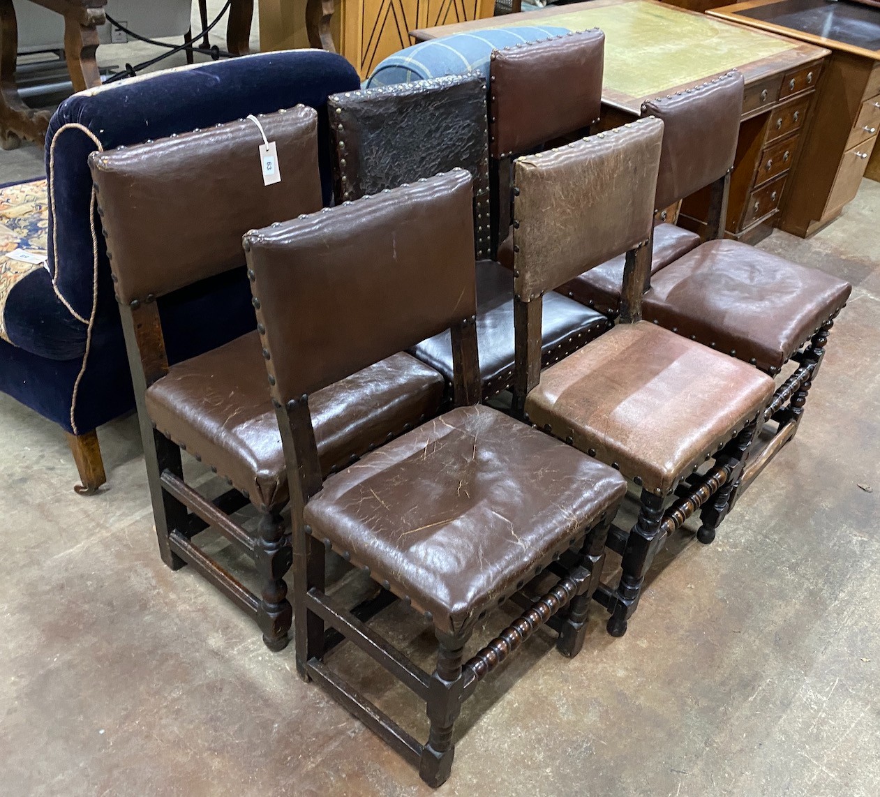 Six Cromwellian style oak and leather dining chairs